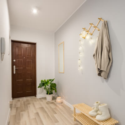 Wall lights and ceiling spotlights used to illuminate a domestic hallway