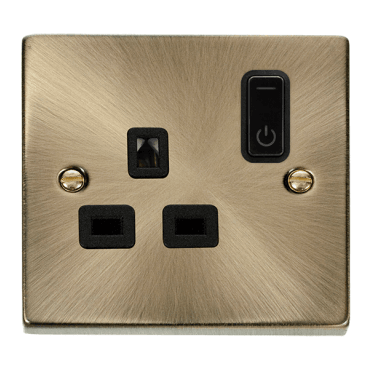 VPAB30535BK Decorative Single Ingot Smart Switched Socket with Black Insert in Antique Brass