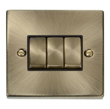 VPAB413BK Decorative 3G 2W Ingot Switch with Black Insert in Antique Brass