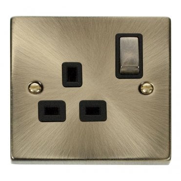 VPAB535BK Decorative Single Ingot Switched Socket with Black Insert in Antique Brass