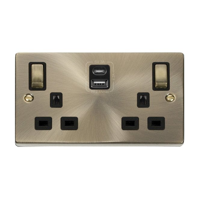 Click Switches and Sockets VPAB586BK Decorative Double Ingot Switched Socket with Dual USB SLOTS (4.2A) A+C with Black Inserts in Antique Brass