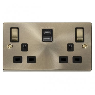 VPAB586BK Decorative Double Ingot Switched Socket with Dual USB SLOTS (4.2A) A+C with Black Inserts in Antique Brass