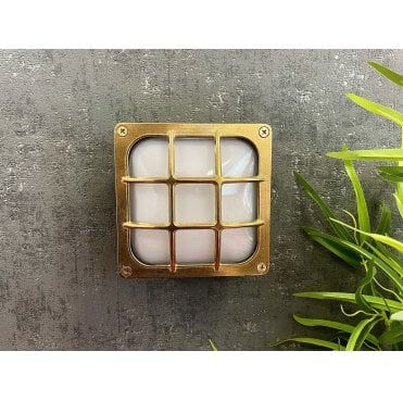 Navigator 09609 Outdoor IP64 1 Light Square Bulkhead Light in a Raw Brass Finish